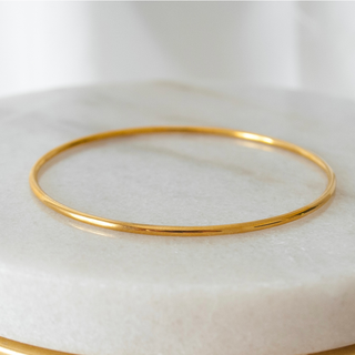 Gold bangles for women featuring elegant and durable 18k gold-plated designs.